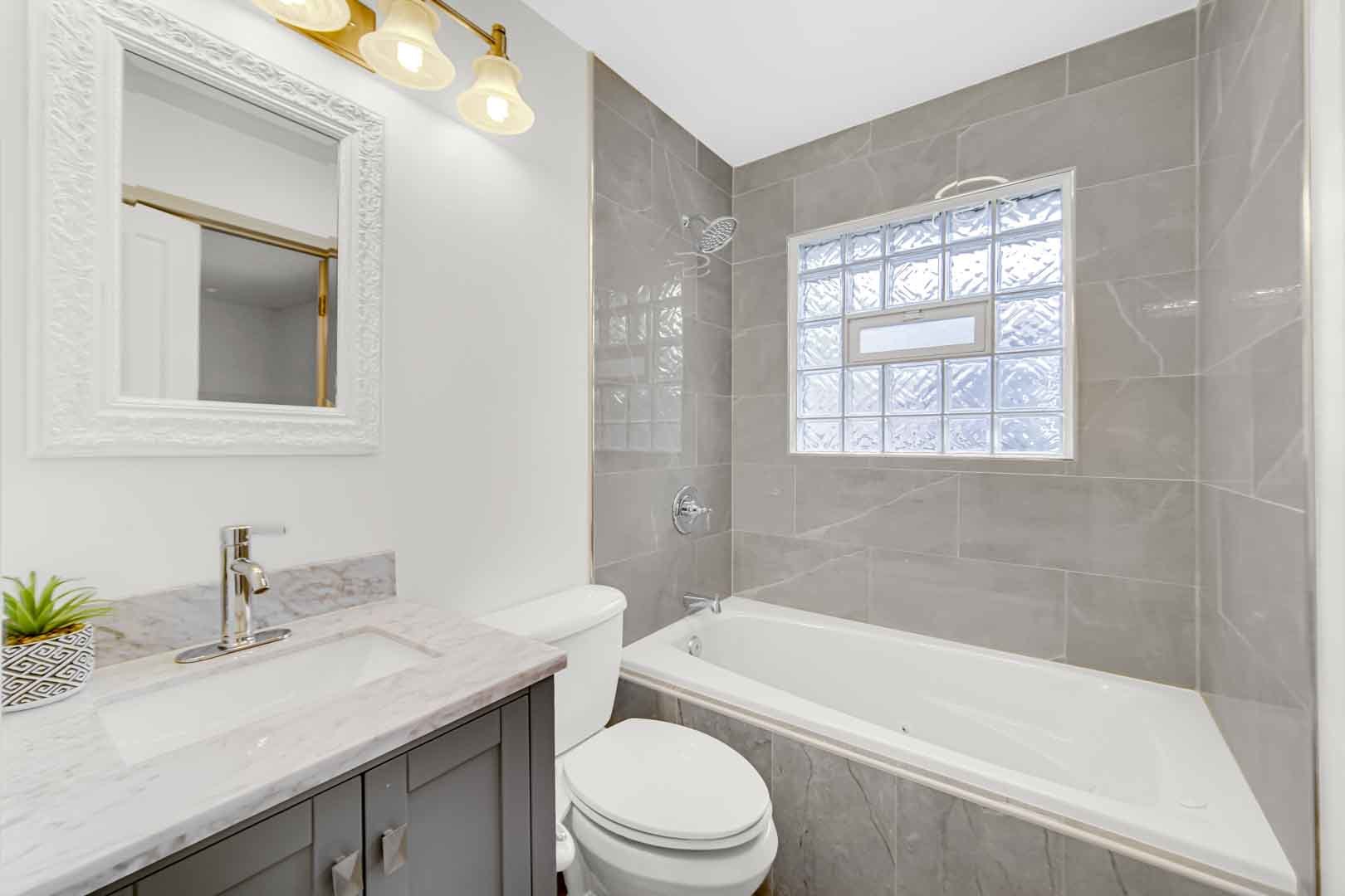 16607 Robey Street Markham, IL 60428 - Photo 20 of 24 a bathroom with a sink toilet a bathtub and shower