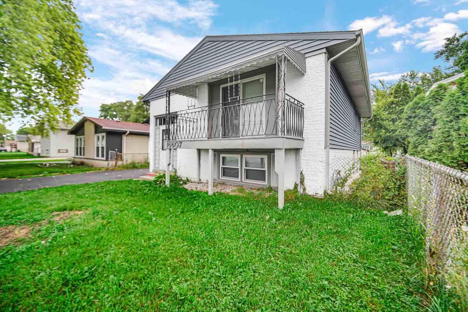 16607 Robey Street Markham, IL 60428 - Photo 3 of 24 a view of house with backyard and garden