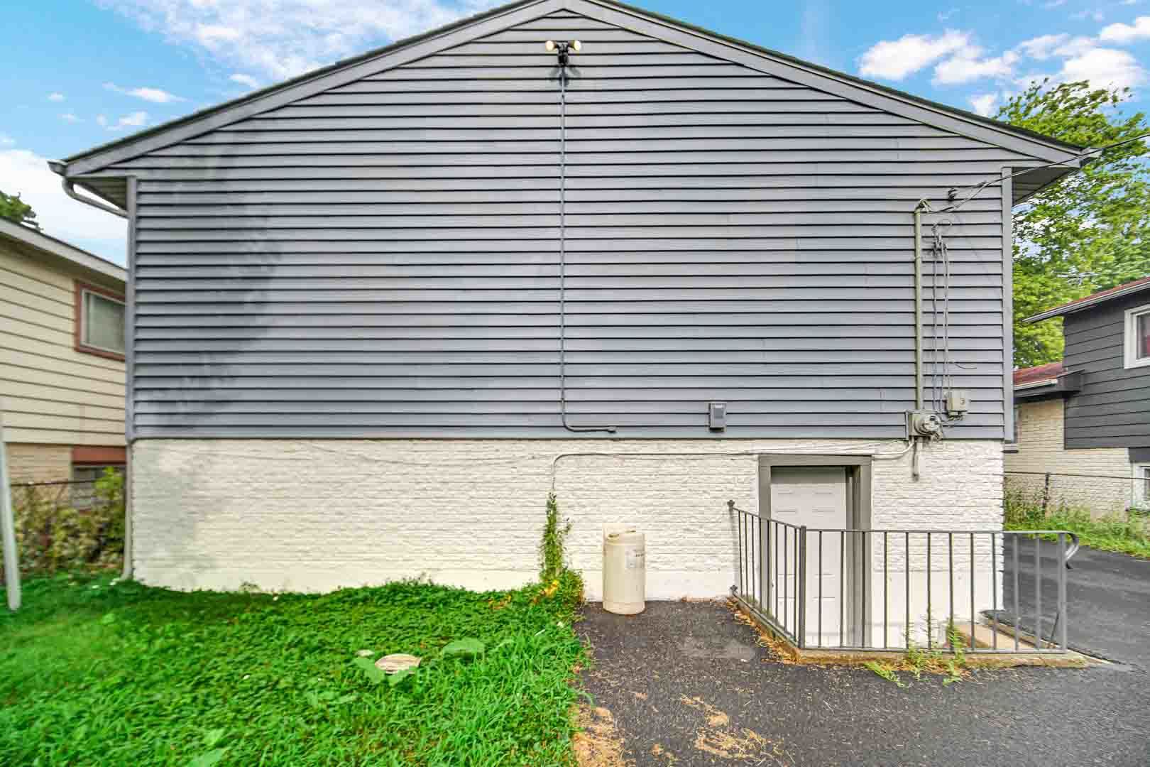 16607 Robey Street Markham, IL 60428 - Photo 6 of 24 a front view of a house with a yard