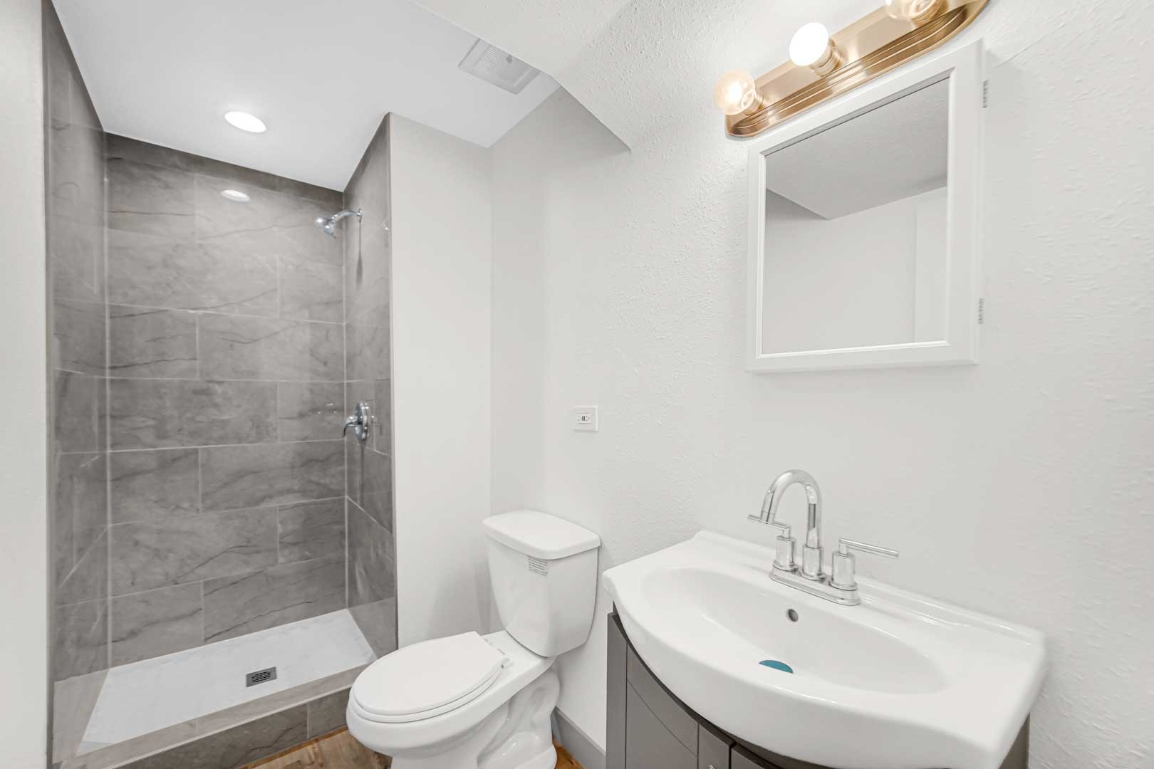 16607 Robey Street Markham, IL 60428 - Photo 8 of 24 a bathroom with a sink toilet and shower