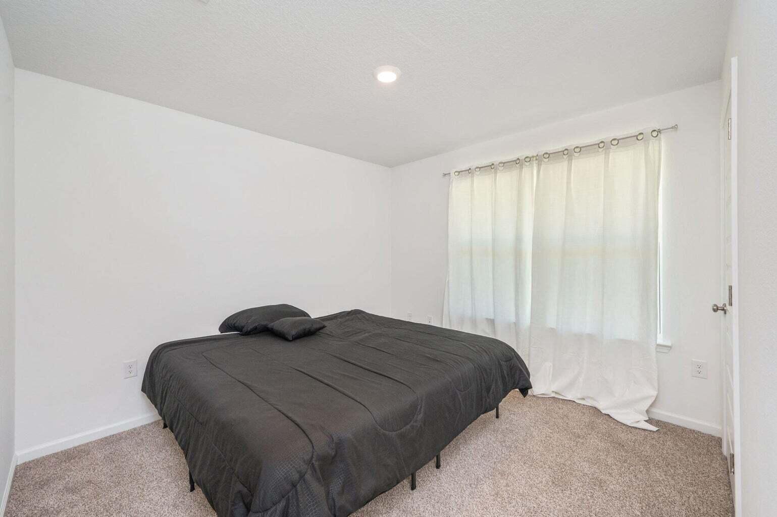 103 Riverwalk Circle Freeport, FL 32439 - Photo 32 of 34 a bedroom with a bed and window