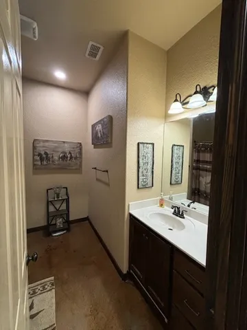 a bathroom with a sink double vanity and a mirror