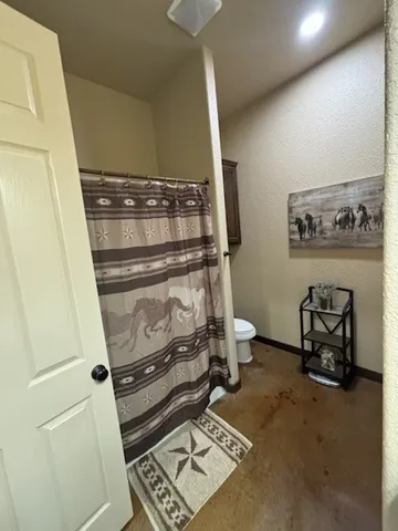 a bathroom with a toilet