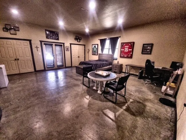 a lobby with furniture and air hockey table