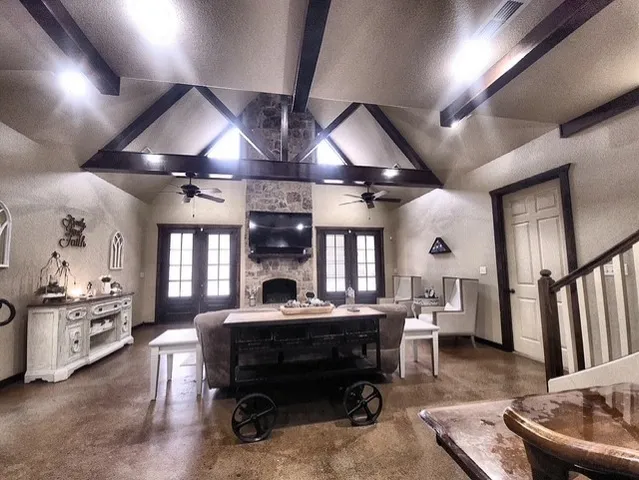 a living room with furniture and a fireplace