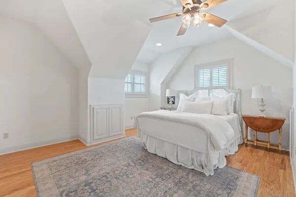 a bedroom with bed and window