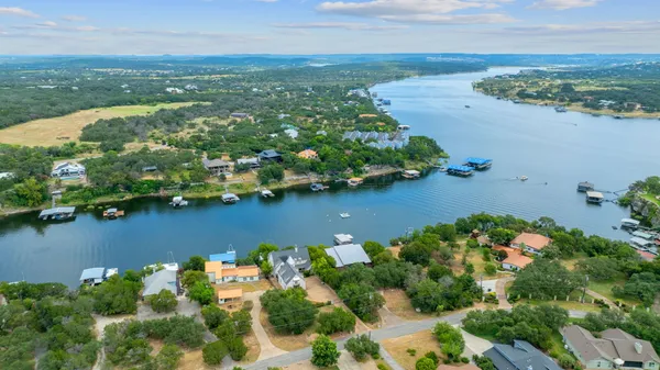 an aerial view of a houses with ocean view