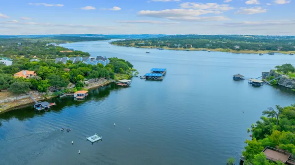 an aerial view of a houses with outdoor space