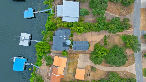 an aerial view of a house with outdoor space
