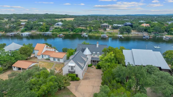 an aerial view of a house with a lake view