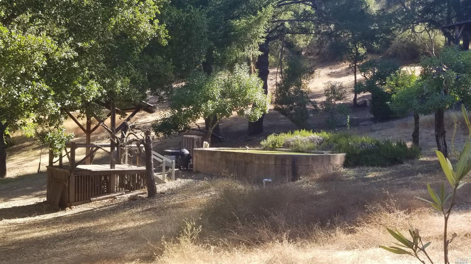 a view of a back yard of the house