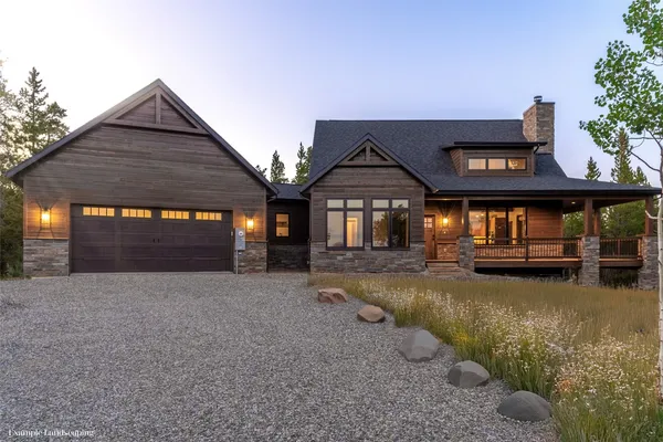 a view of a house with a yard balcony and sitting area