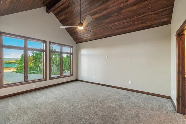 a view of room with window and ceiling fan