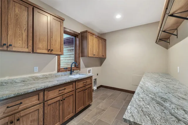 a kitchen with a sink and cabinets
