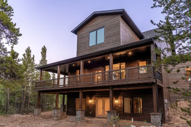 a view of front door of house with stairs