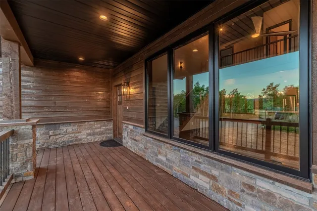 a view of a balcony with wooden floor