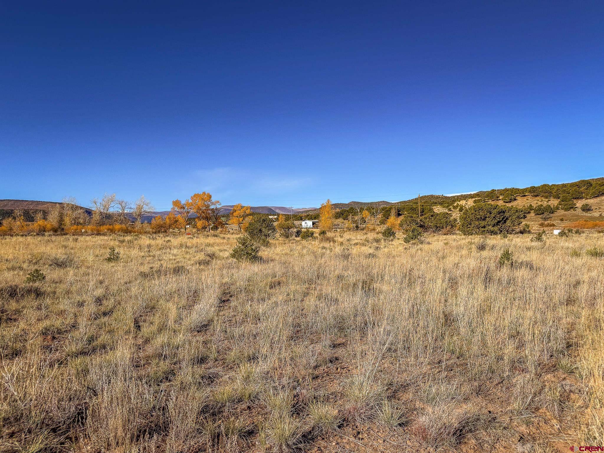 331 Red Feather Road South Fork, CO 81154 - Photo 3 of 6 a view of a city with mountains in the background