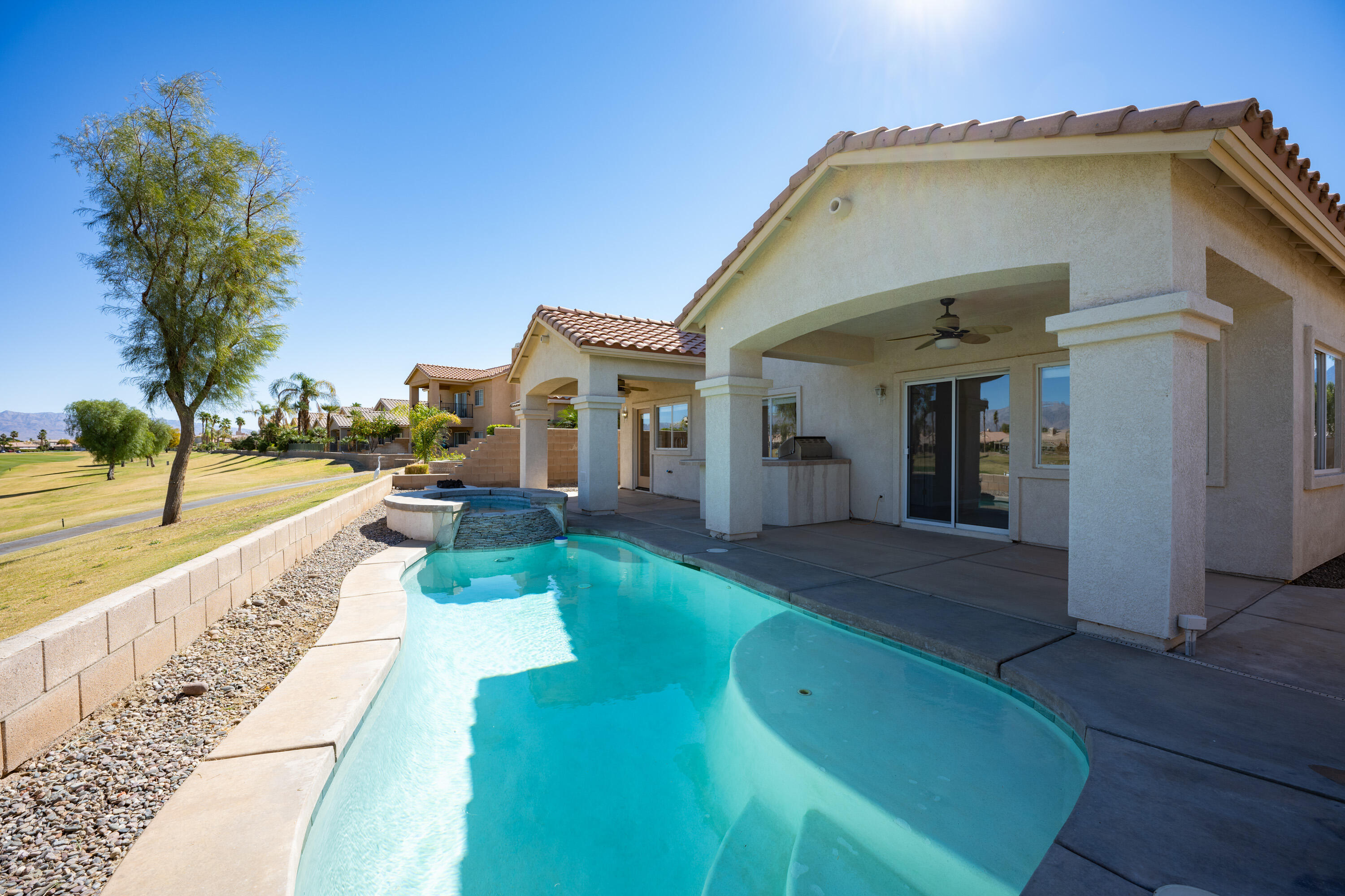 80162 Pebble Beach Drive Indio, CA 92201 - Photo 24 of 48 a front view of a house with a yard