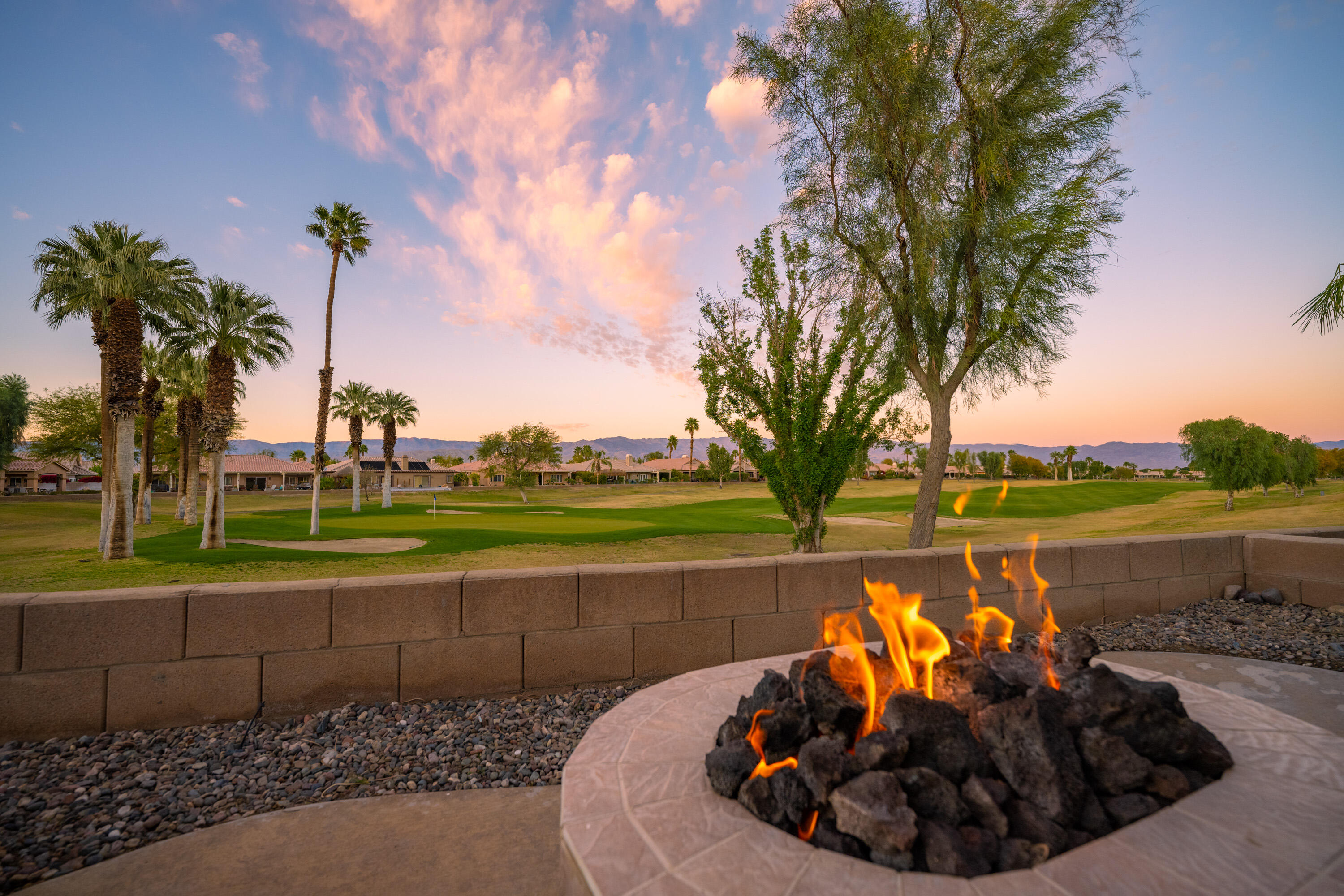 80162 Pebble Beach Drive Indio, CA 92201 - Photo 31 of 48 a view of a lake with a fountain and a big yard