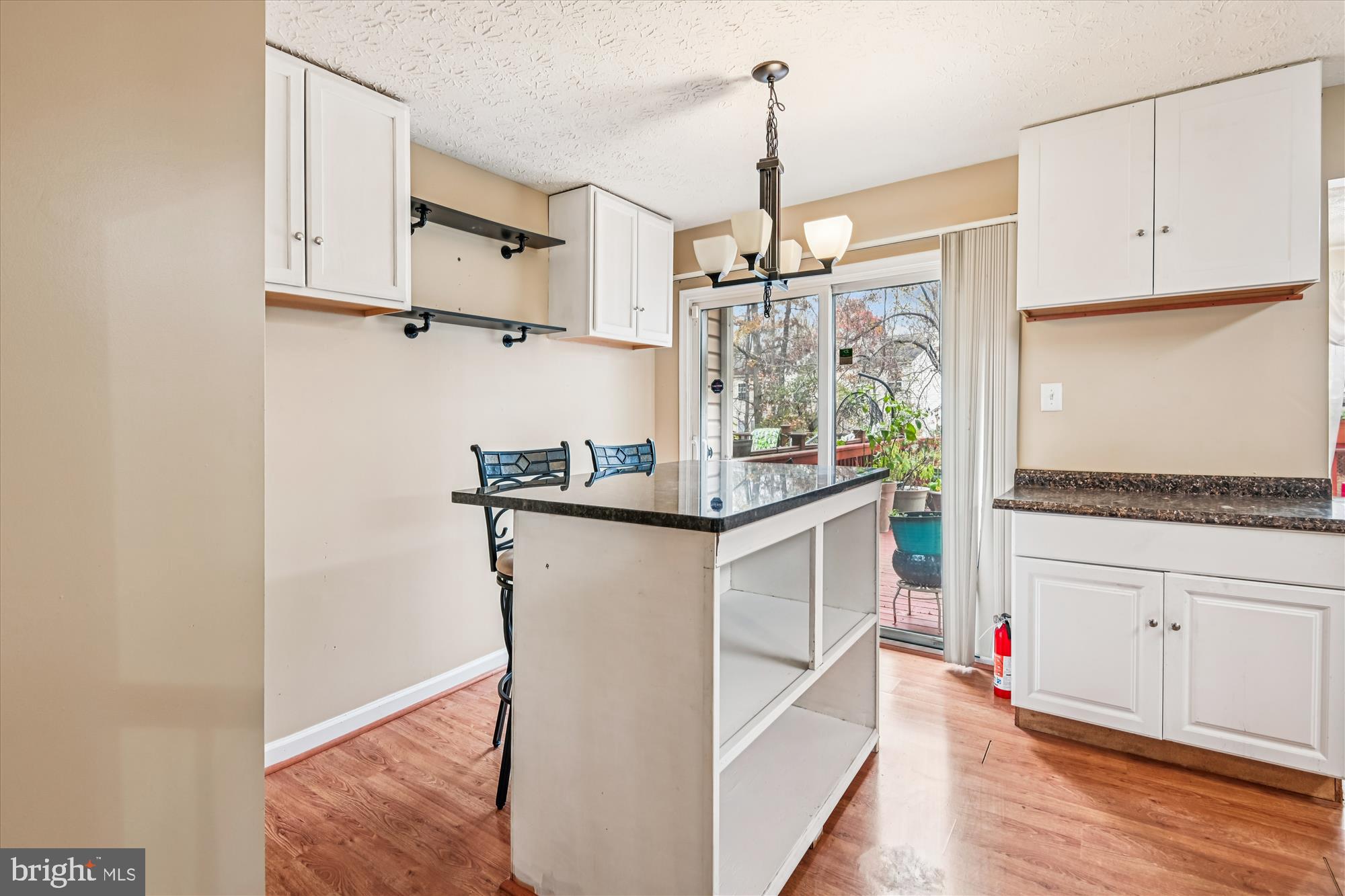 8018 Brookmead Court Severn, MD 21144 - Photo 13 of 35 a kitchen with white cabinets and white appliances