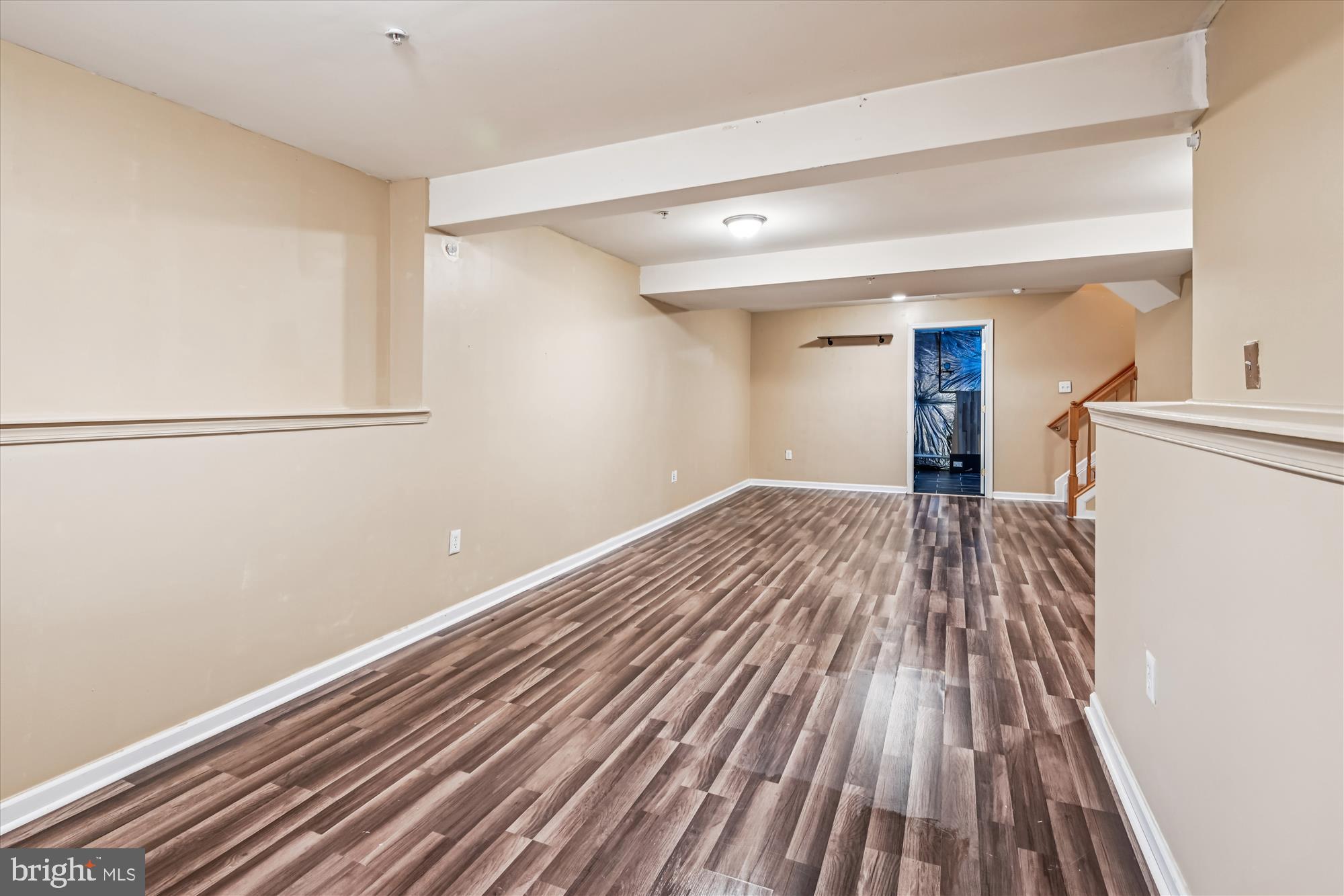 8018 Brookmead Court Severn, MD 21144 - Photo 17 of 35 a view of a room with wooden floor and electronic appliances