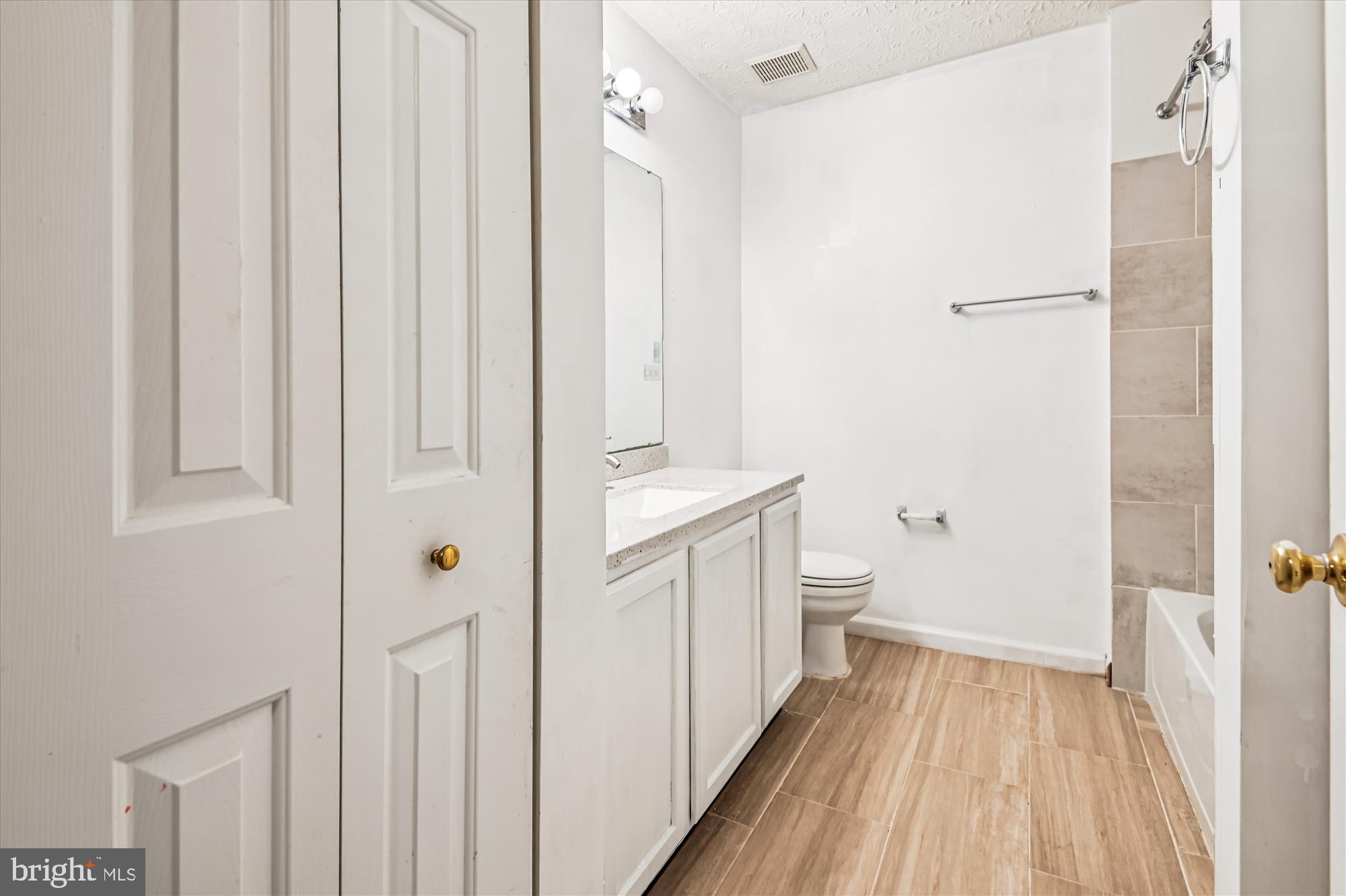 8018 Brookmead Court Severn, MD 21144 - Photo 19 of 35 a bathroom with a sink a toilet and shower