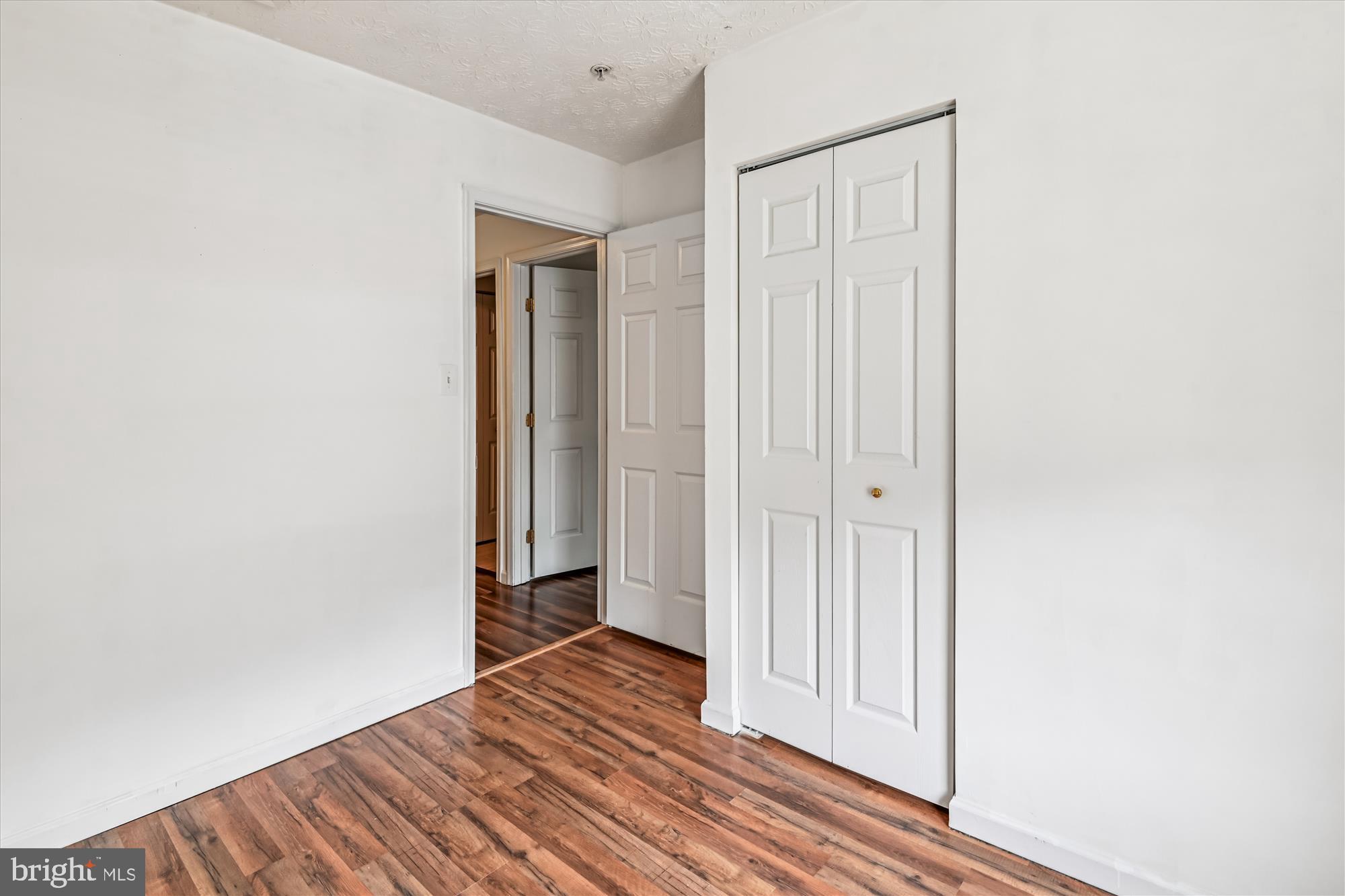 8018 Brookmead Court Severn, MD 21144 - Photo 20 of 35 a view of a livingroom with wooden floor