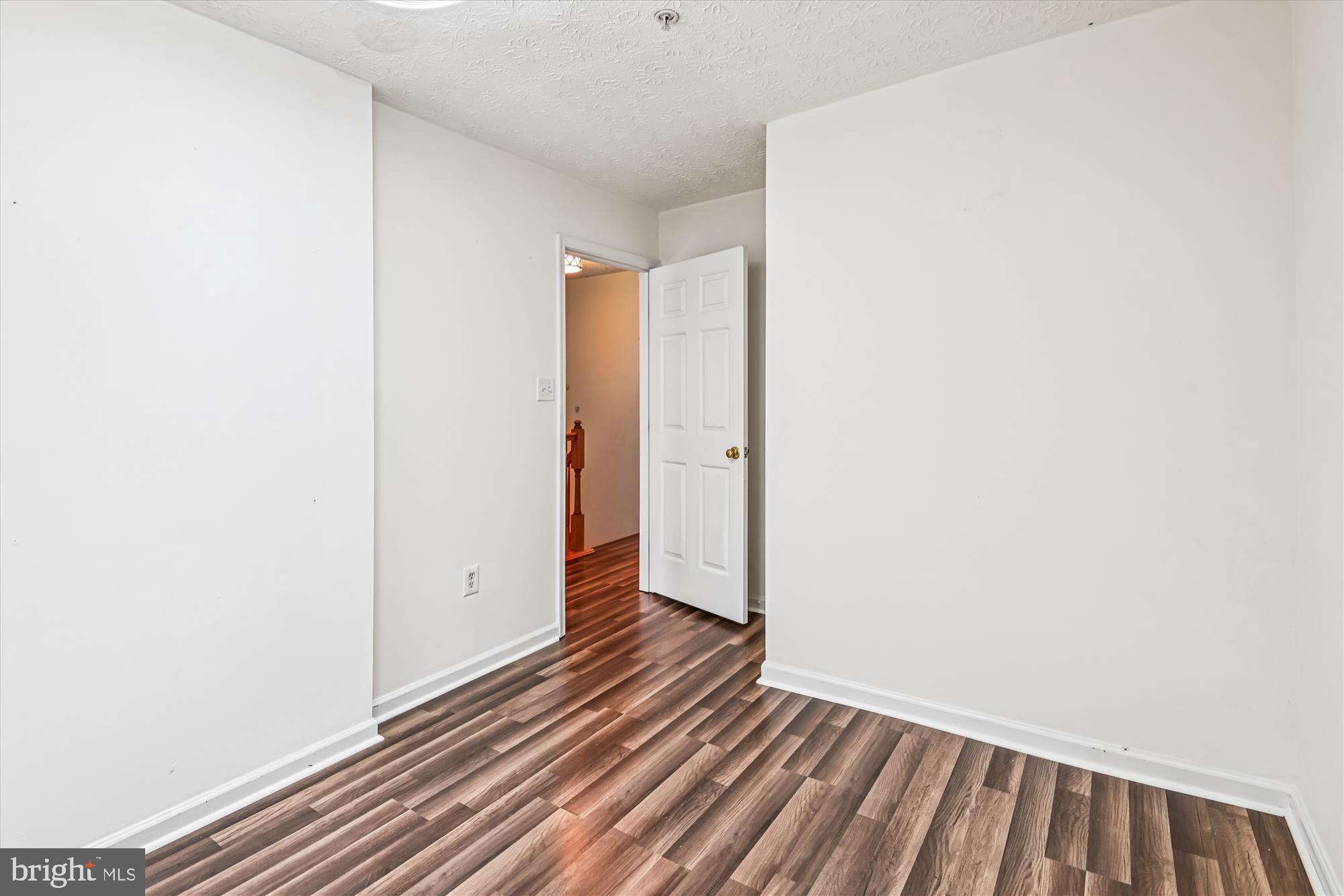 8018 Brookmead Court Severn, MD 21144 - Photo 24 of 35 a view of a room with wooden floor