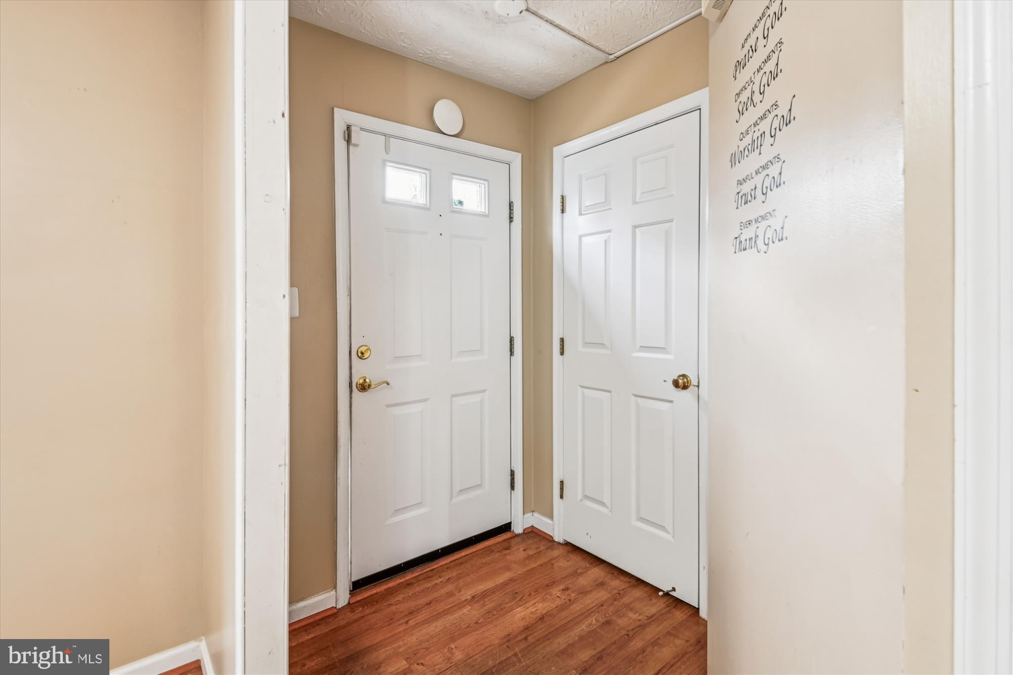 8018 Brookmead Court Severn, MD 21144 - Photo 3 of 35 a view of a hallway with wooden floor