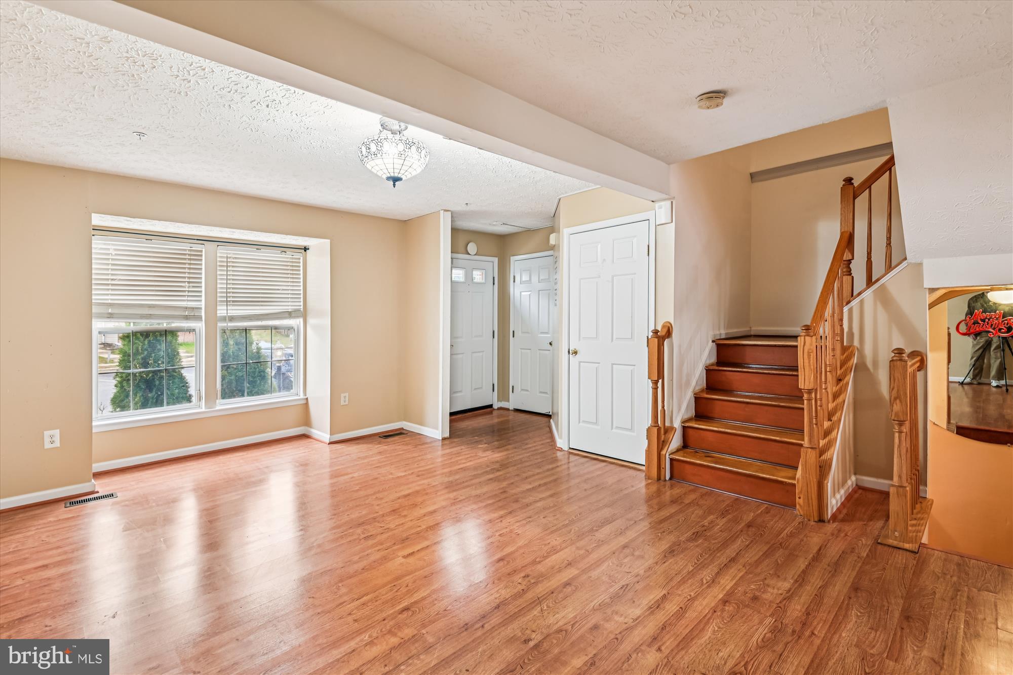 8018 Brookmead Court Severn, MD 21144 - Photo 4 of 35 wooden floor in an empty room with a window