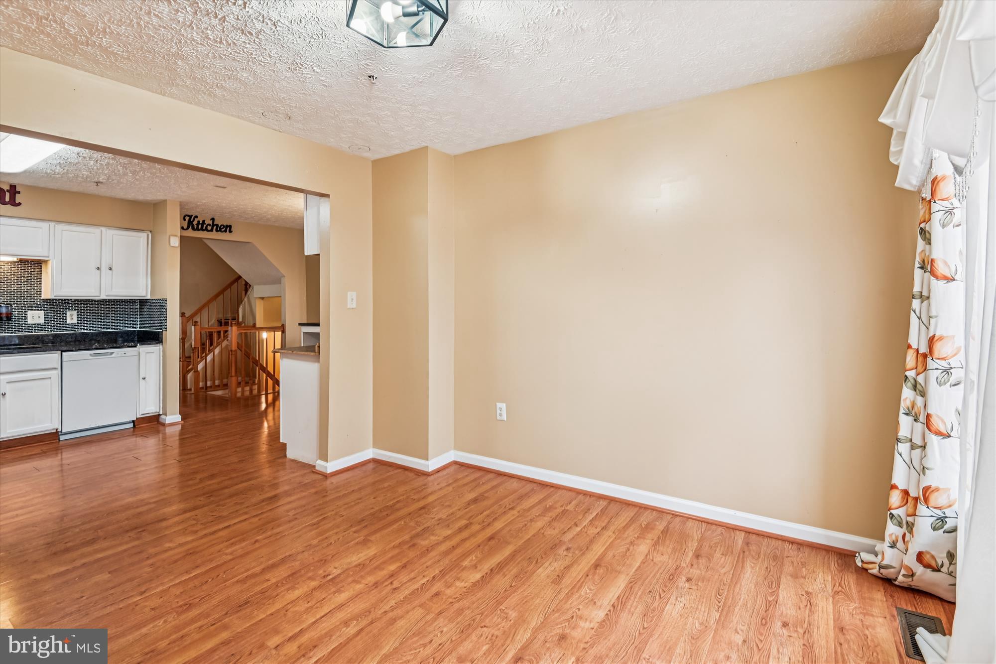 8018 Brookmead Court Severn, MD 21144 - Photo 6 of 35 a view of empty room with wooden floor and fan