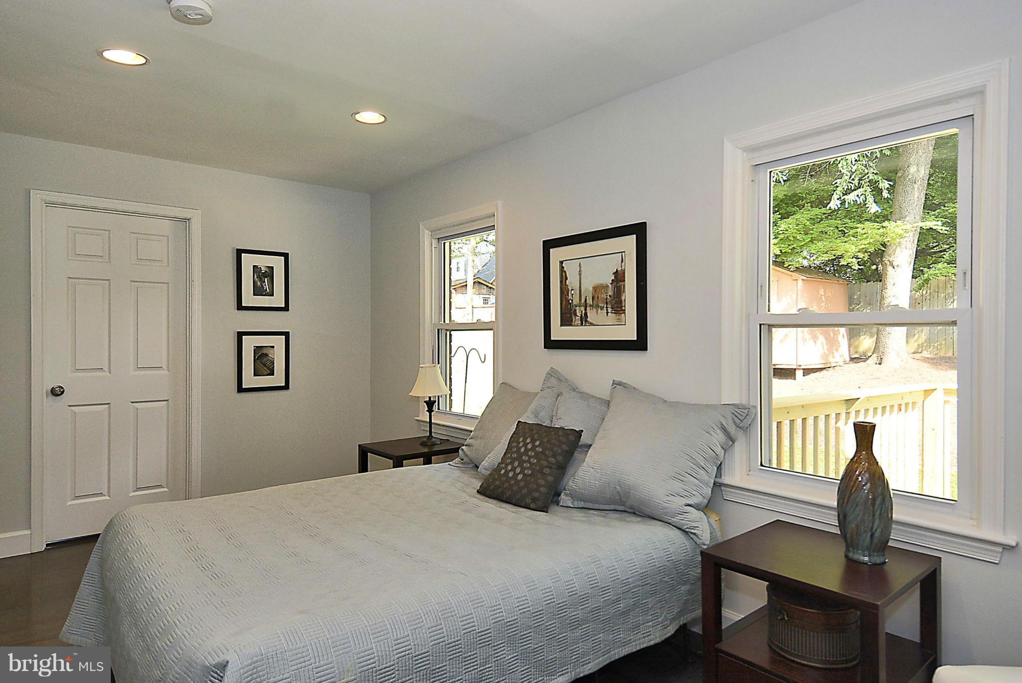 409 Branch Drive Silver Spring, MD 20901 - Photo 11 of 30 a bedroom with a bed and a window