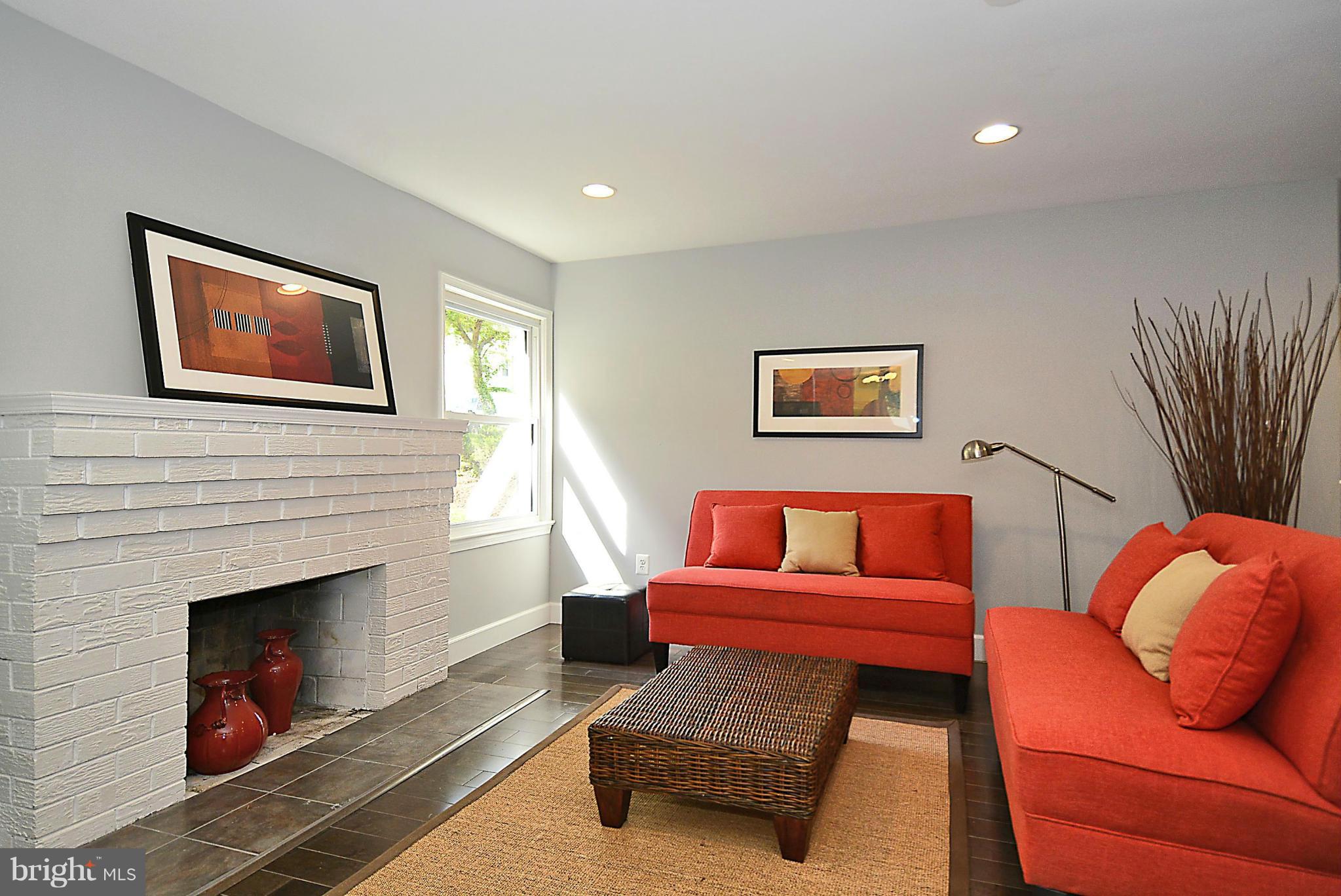 409 Branch Drive Silver Spring, MD 20901 - Photo 2 of 30 a living room with furniture and a fireplace