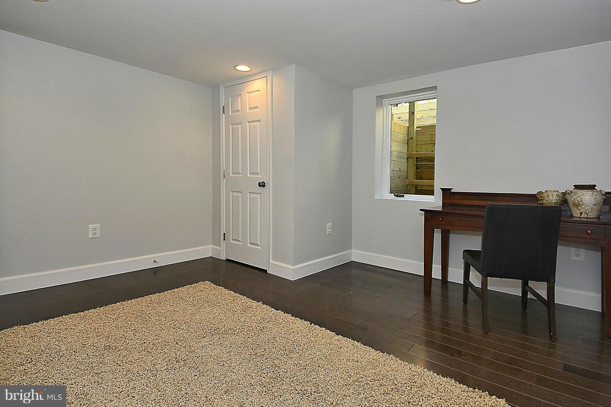 409 Branch Drive Silver Spring, MD 20901 - Photo 21 of 30 a workspace with furniture and wooden floor