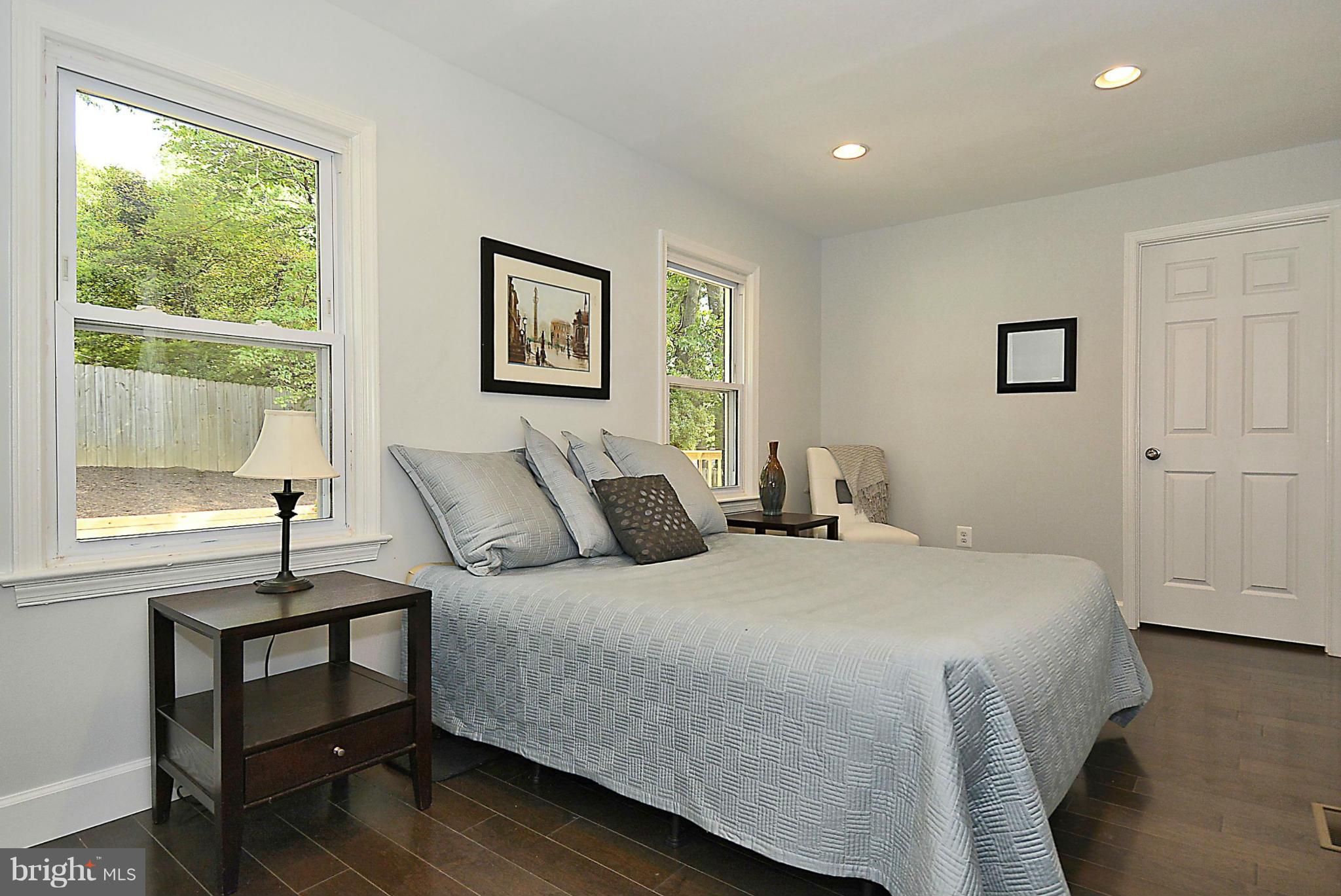 409 Branch Drive Silver Spring, MD 20901 - Photo 10 of 30 a bedroom with a bed and a window