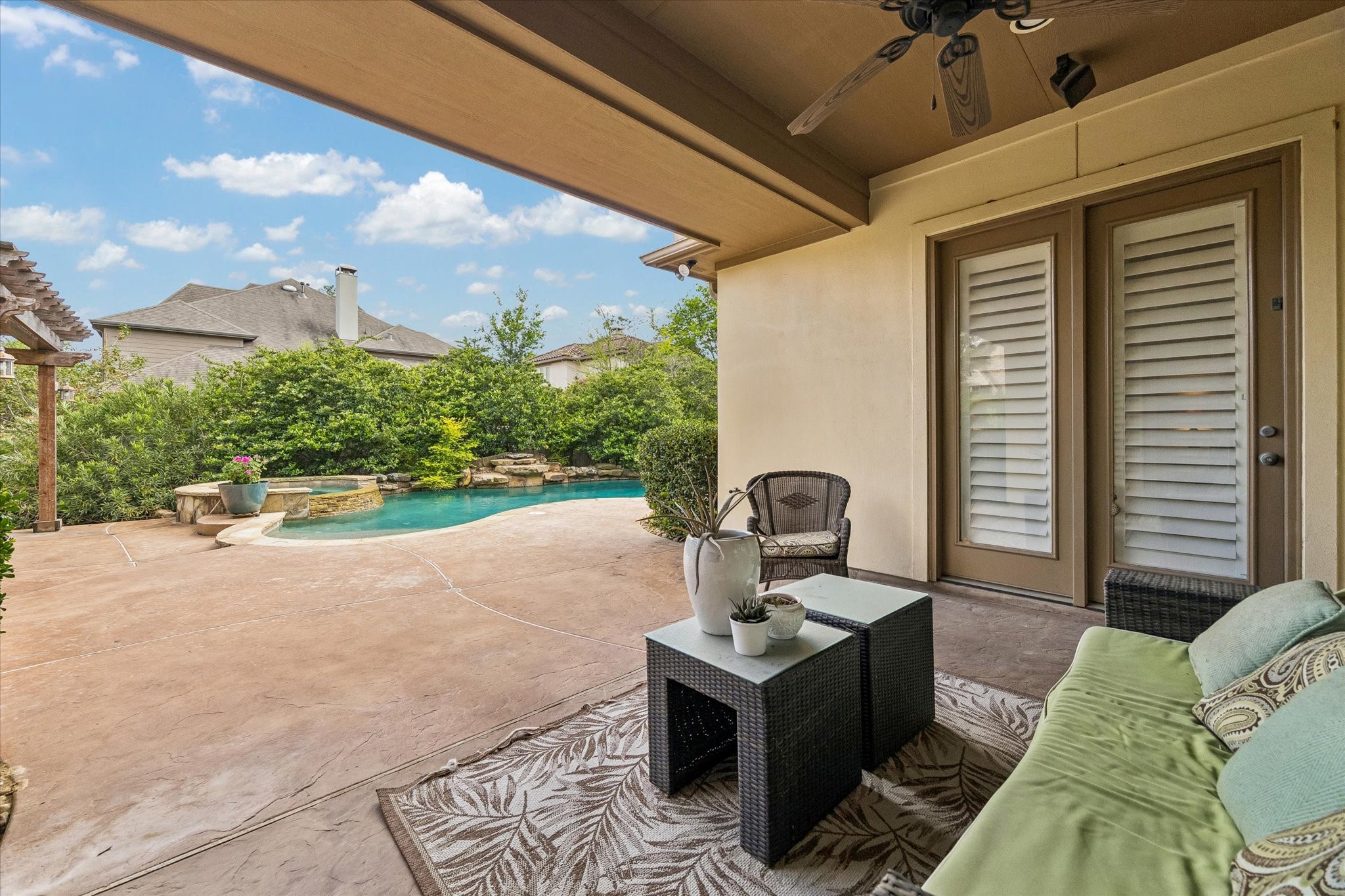 3 Tiburon Court Spring, TX 77389 - Photo 30 of 34 When the Texas sun begins to set, ceiling fans keep the space comfortable as the patio transforms into your favorite place to unwind. Whether you're enjoying a quiet evening with your spouse, entertaining a crowd, or stepping outside directly from the primary suite for one last look at the stars, this is a space you'll use every single day.