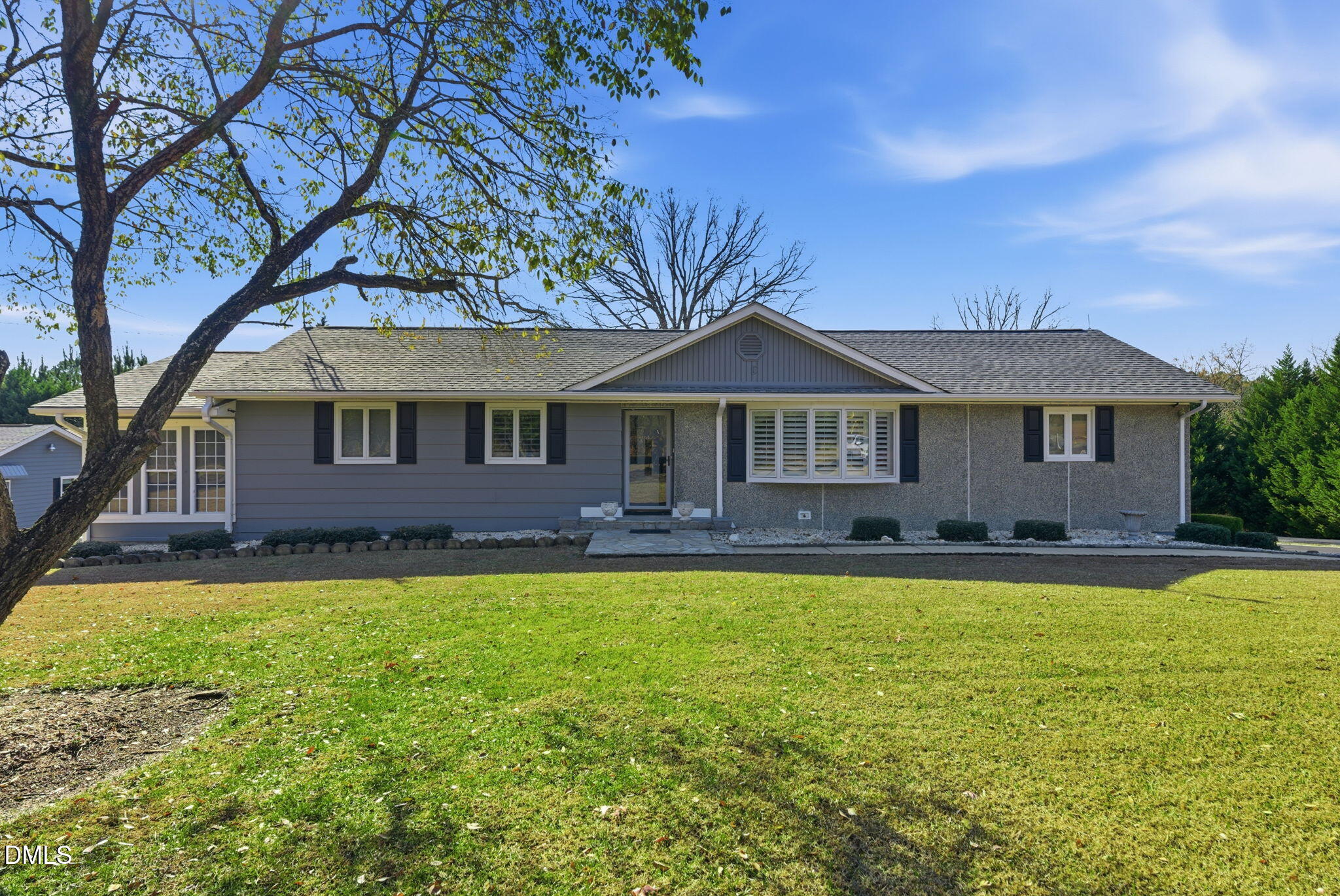 5210 Moncure Pittsboro Road Moncure, NC 27559 - Photo 1 of 58 a front view of a house with a garden