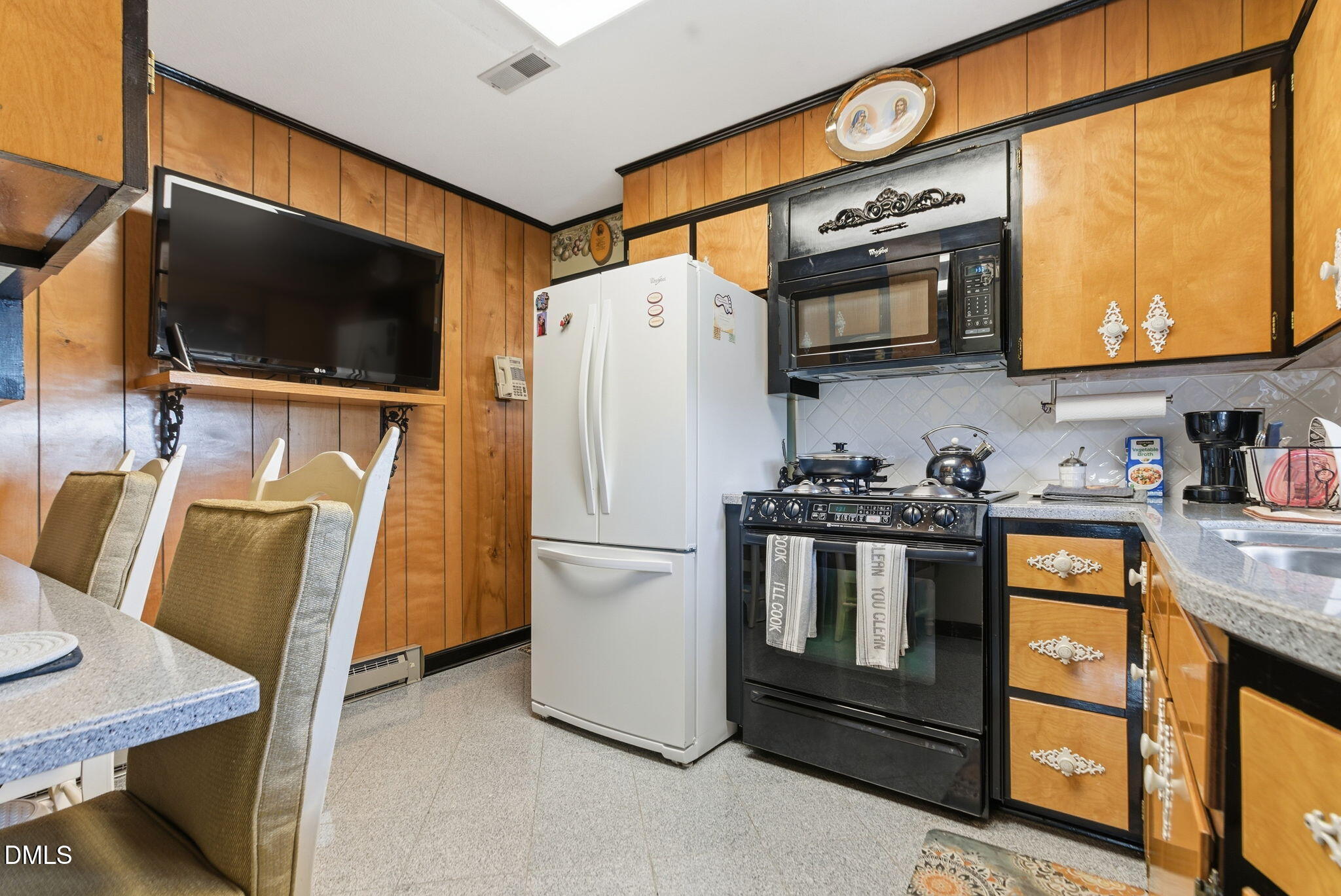 5210 Moncure Pittsboro Road Moncure, NC 27559 - Photo 11 of 58 a kitchen with stainless steel appliances granite countertop a refrigerator a stove top oven a sink and dishwasher