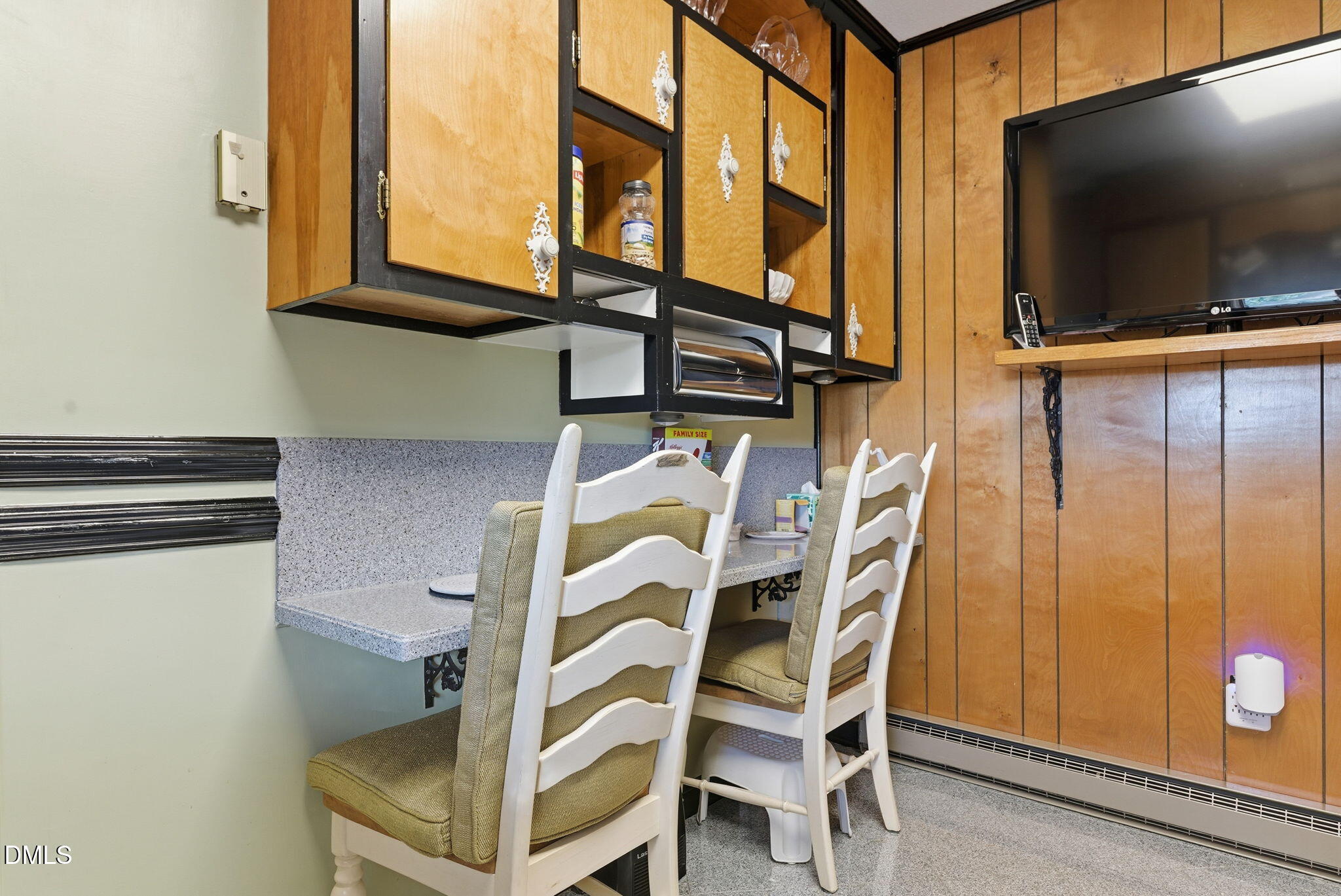 5210 Moncure Pittsboro Road Moncure, NC 27559 - Photo 12 of 58 a view of a kitchen with furniture and a flat screen tv