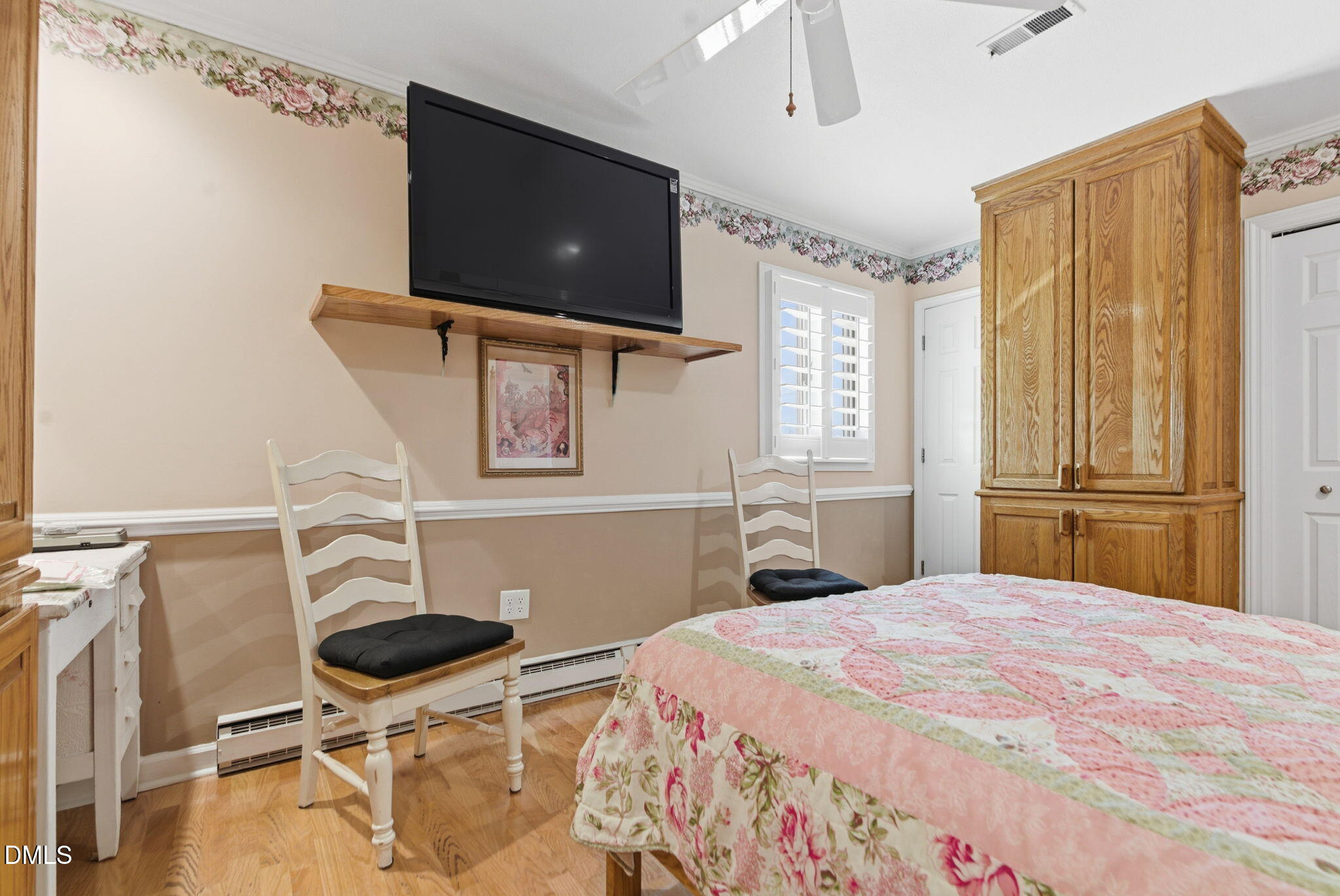 5210 Moncure Pittsboro Road Moncure, NC 27559 - Photo 15 of 58 a bedroom with a bed and a flat screen tv