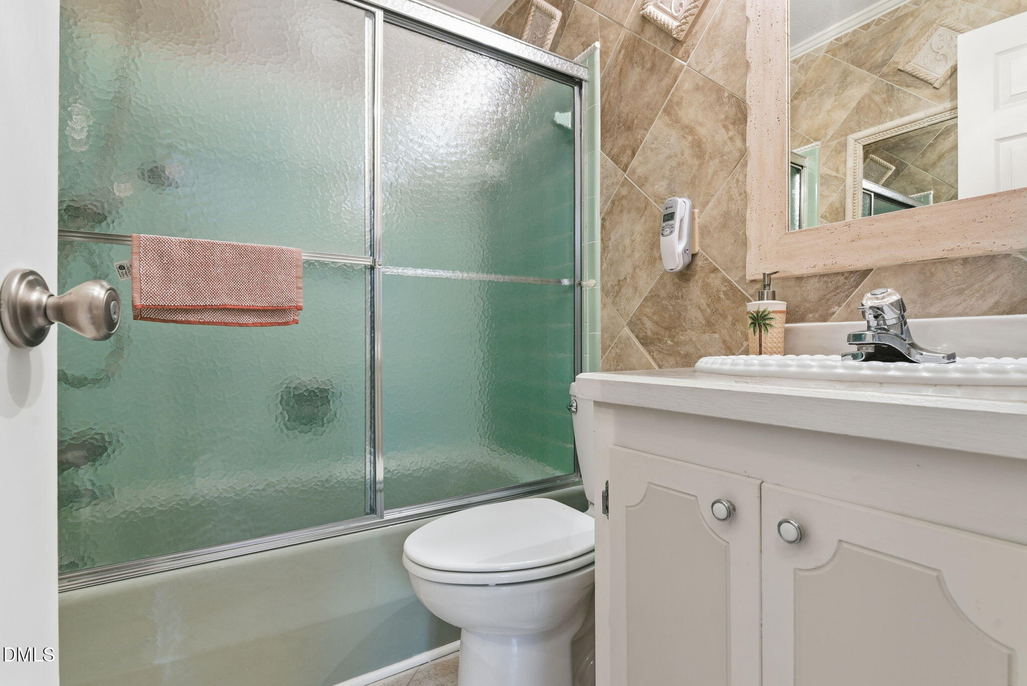 5210 Moncure Pittsboro Road Moncure, NC 27559 - Photo 19 of 58 a bathroom with a sink a toilet and shower