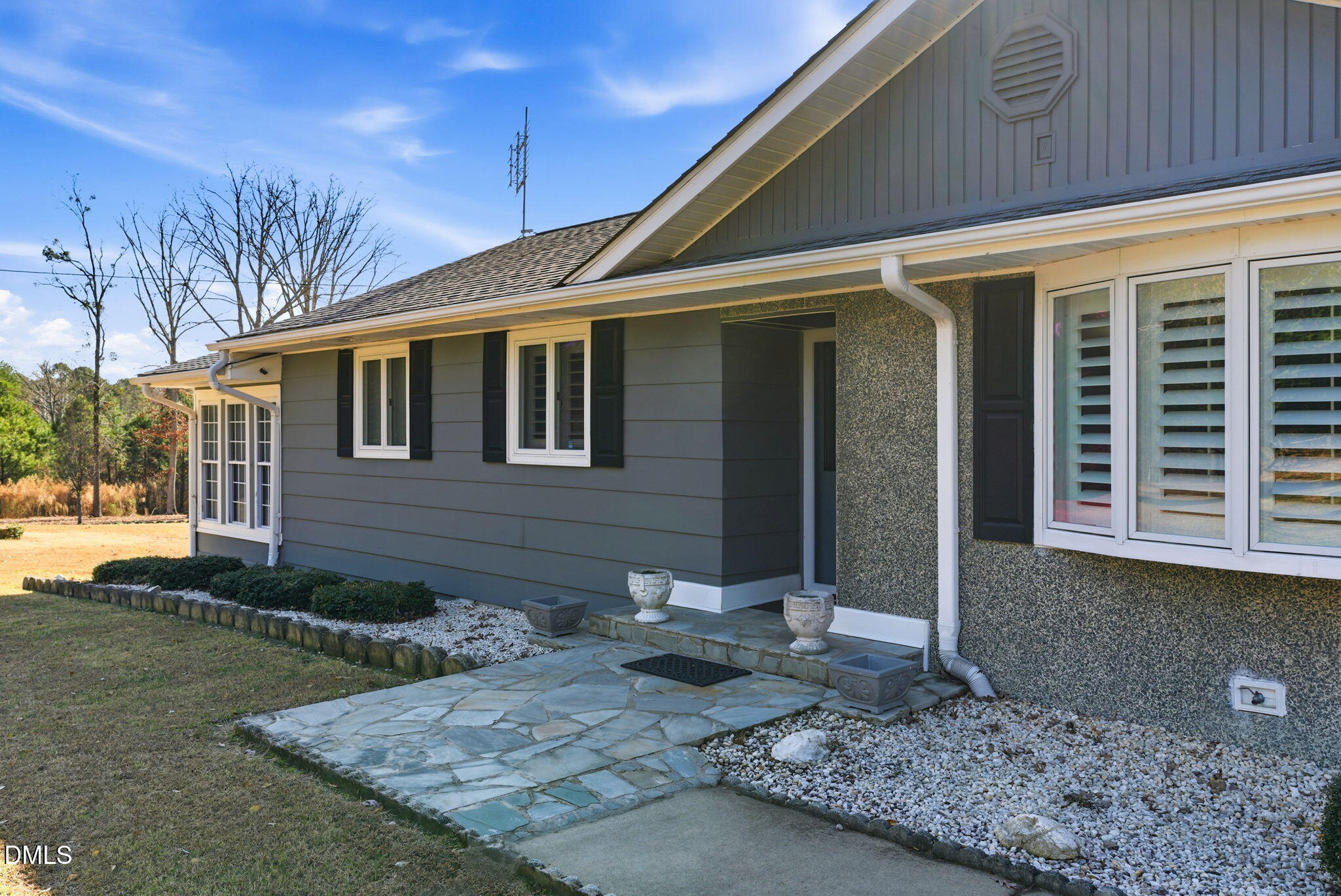 5210 Moncure Pittsboro Road Moncure, NC 27559 - Photo 2 of 58 a front view of a house with garden