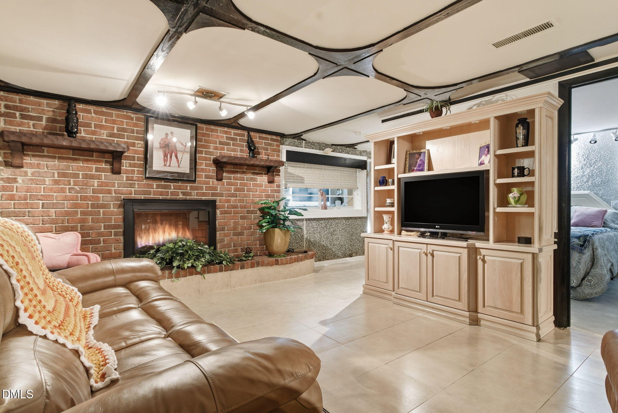 5210 Moncure Pittsboro Road Moncure, NC 27559 - Photo 24 of 58 a living room with furniture and a flat screen tv