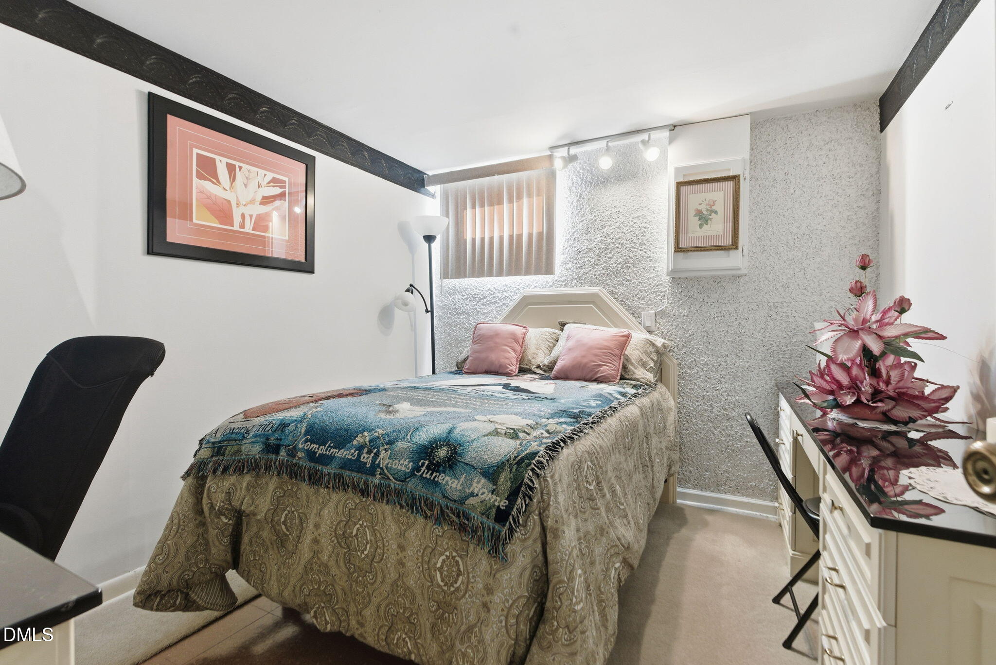 5210 Moncure Pittsboro Road Moncure, NC 27559 - Photo 27 of 58 a bedroom with bed and a painting on the wall