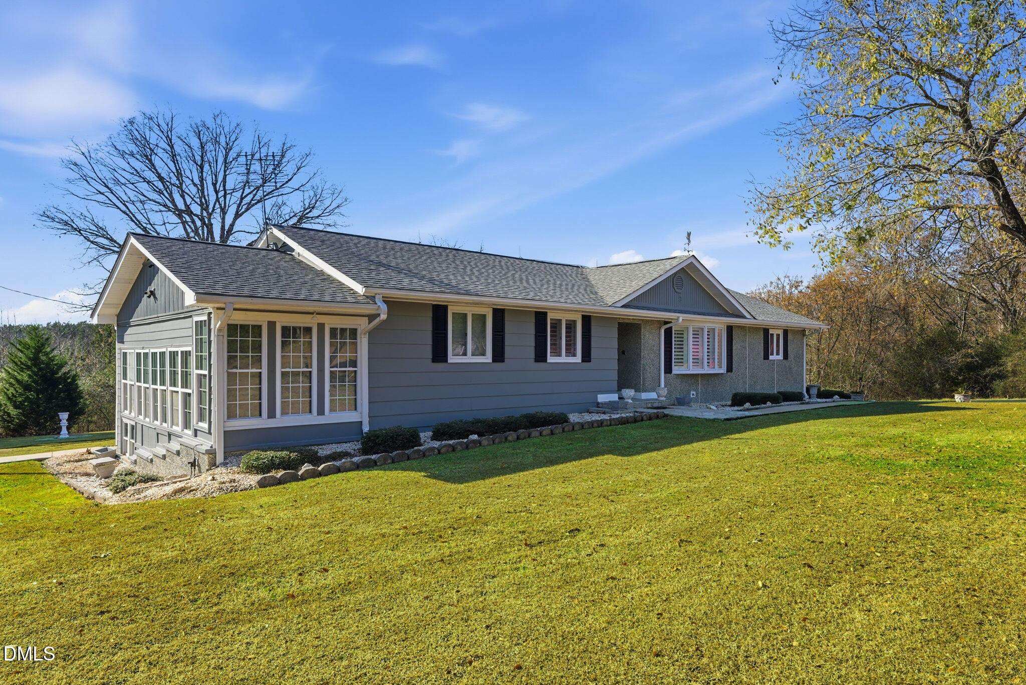 5210 Moncure Pittsboro Road Moncure, NC 27559 - Photo 3 of 58 a front view of a house with yard and green space