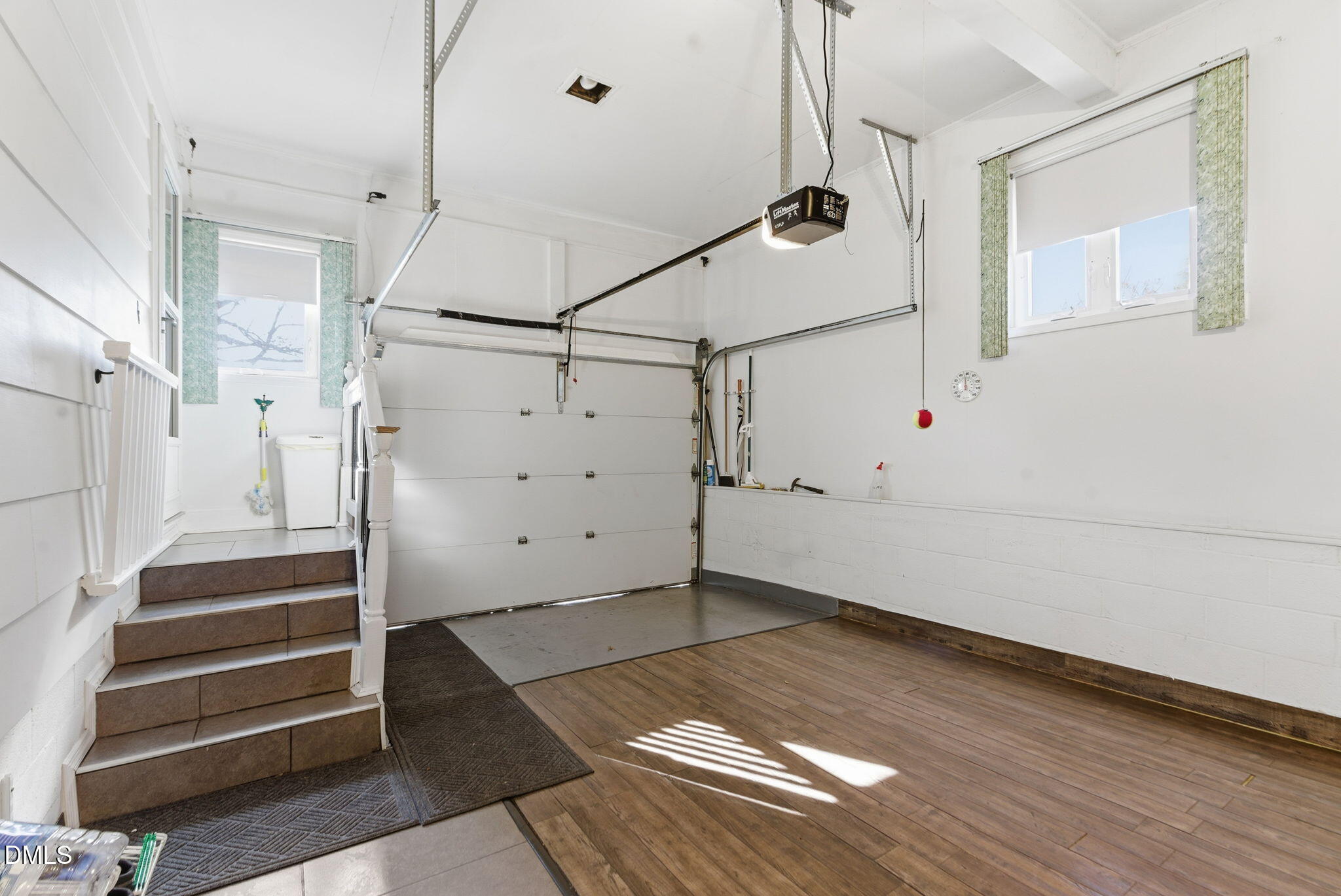 5210 Moncure Pittsboro Road Moncure, NC 27559 - Photo 36 of 58 a view of a room with stairs and a wooden floor