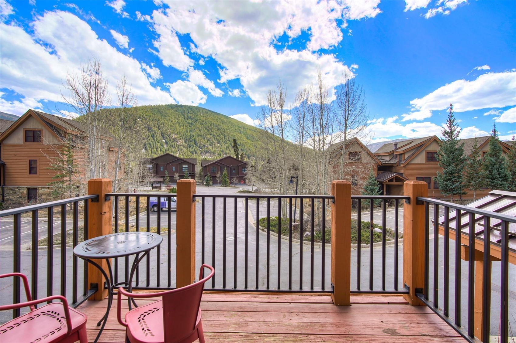 71 Antlers Gulch Road, Unit 303 Keystone, CO 80435 - Photo 8 of 35 a view of a chairs on the roof deck