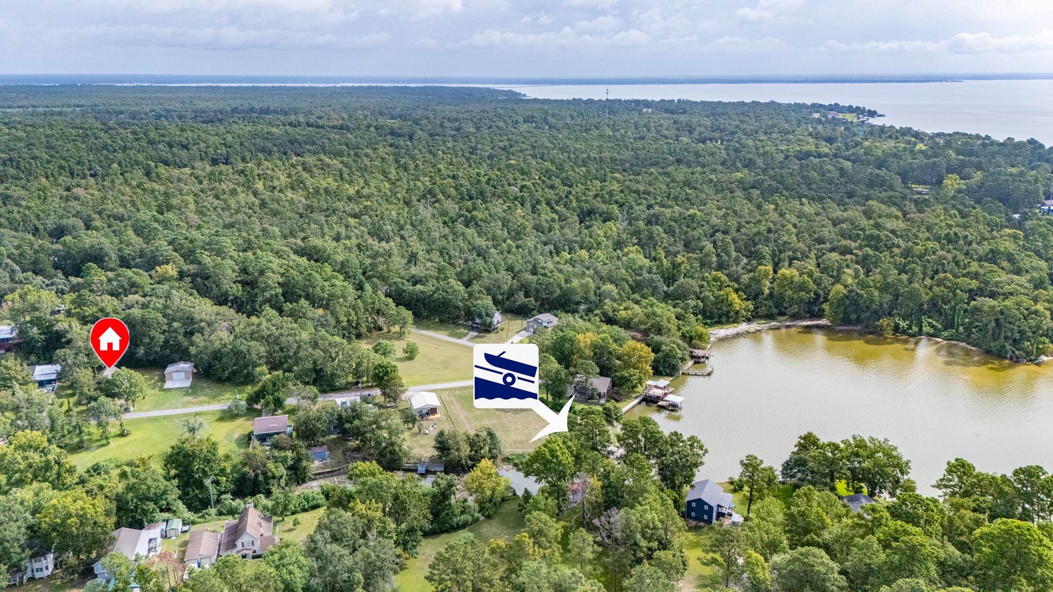 161 White Oak Street Point Blank, TX 77364 - Photo 1 of 23 an aerial view of a house with a yard and lake view