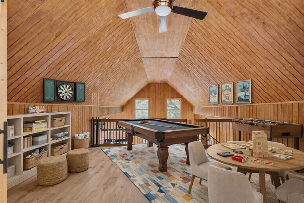 a dining room with furniture and wooden floor