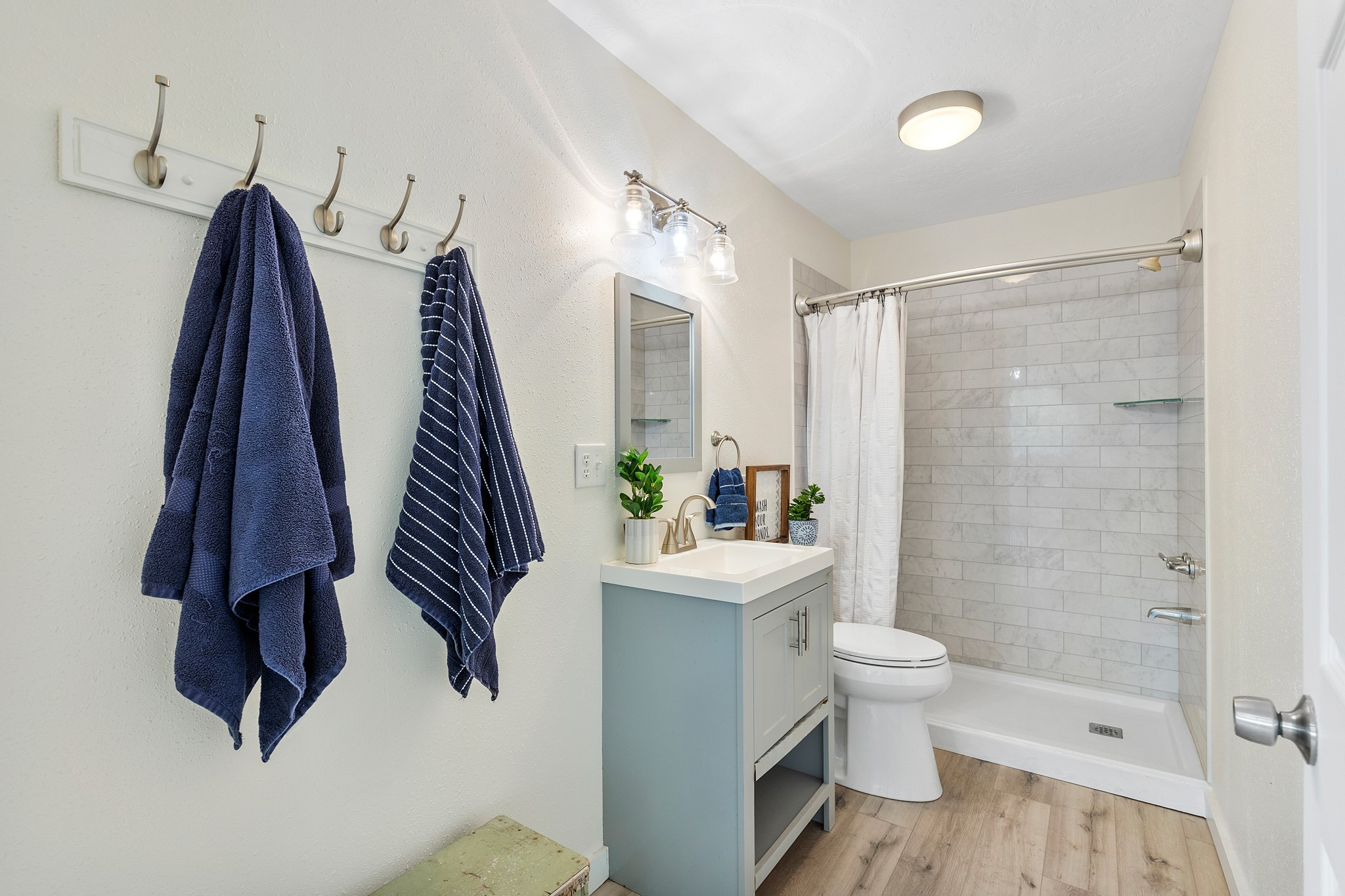 161 White Oak Street Point Blank, TX 77364 - Photo 12 of 23 a bathroom with a sink a toilet and a shower